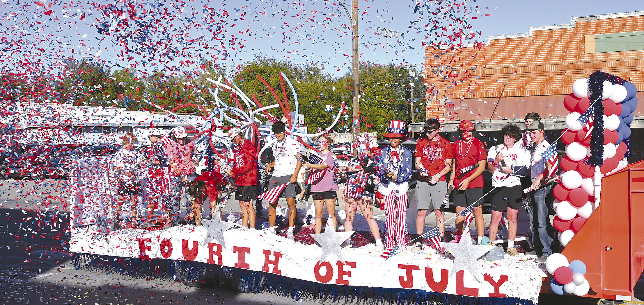 Blue ribbon winner. The sophomore class float depicting the Fourth of July passes by the judges stand with a big shower of red, white, and blue confetti. The class won tops in the float competition, which featured “Holidays.” The 2023 homecoming parade rolled down Main Street through the down town area on Friday afternoon. Donnie Lucas /AlbanyNews