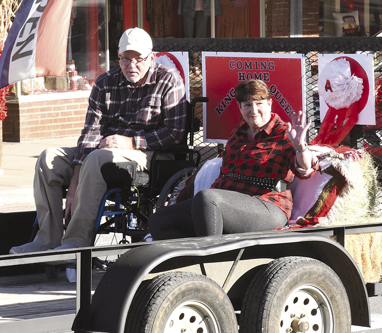 Coming Home! Coming Home King Randy Deal (above, l) and Queen Patti Swank (r) wave to the crowd. The two honorees from the Class of 1973 were also presented that night during halftime festivities. Donnie Lucas /AlbanyNews