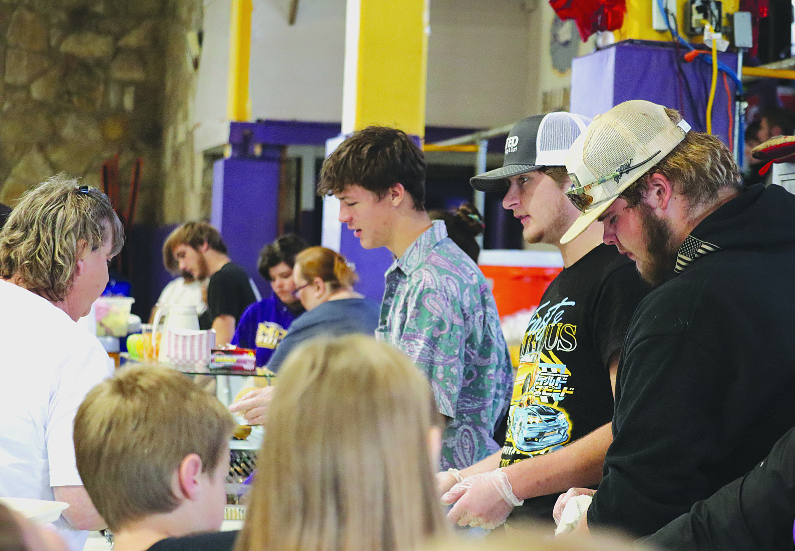 Moran National Honor Society members (l-r) Ellis Hise, Caleb York, and Tyler Hale serve students, parents, and community residents during Moran ISD’s annual Thanksgiving meal on Nov. 16 before the school district took off for the week-long holiday break. This week, almost 30 students are participating in elementary and middle school UIL events. Photo Provided By Moran School