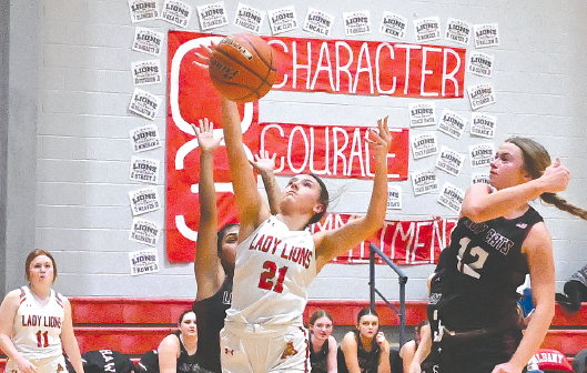 Ashlyn Miller gets the ball inside and goes up for a two-point attempt during the Lady Lions’ district opener against a strong Hawley team on Tuesday night. The Albany girls continue to make progress in building a new program. They will have an open date next Tuesday, then travel to Stamford for another district game on Friday, Dec. 20.