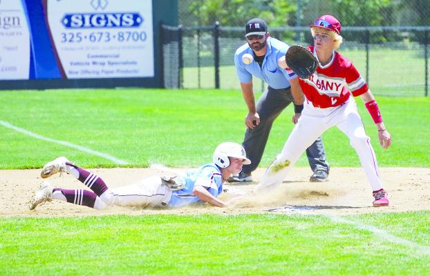 With his foot on the bag, first baseman Calhan Fairchild gets in position for the pick-off attempt of a Hawley player, who makes it back safe. Albany lost the third round regional quarterfinal series to their perennial district foe, which whom they split games during the regular season. Photo By Julia Vega