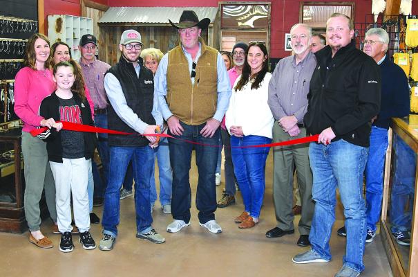 Owners and operators of The Shop, along with representatives of the Albany Chamber of Commerce, cut the ceremonial ribbon at The Shop on the corner of Main and Hill Streets. The store features everything from homegrown meats to handmade saddles and jewelry, as well as space for a couple of barbers. Donnie Lucas / Albany News