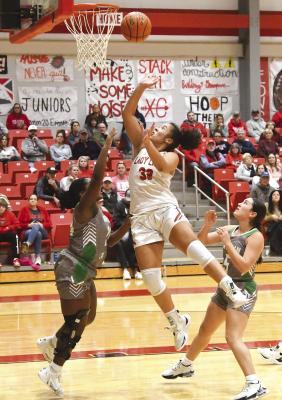 Kiana Roberson gets under the basket for a two-point shot during the Lady Lions’ district game against Hamlin on Tuesday. The girls are open Friday but will be back in action at Stamford next Tuesday. Donnie Lucas / Alb any News