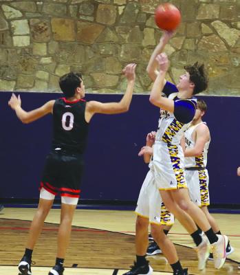 Ellis Hise (r) goes just inside the three-point line for a jumper when Moran hosted its Bulldog Holiday Tournament last weekend. Both the Bulldogs and the Lady Bulldogs finished fourth at the local tourney. Photo Provided By Moran School