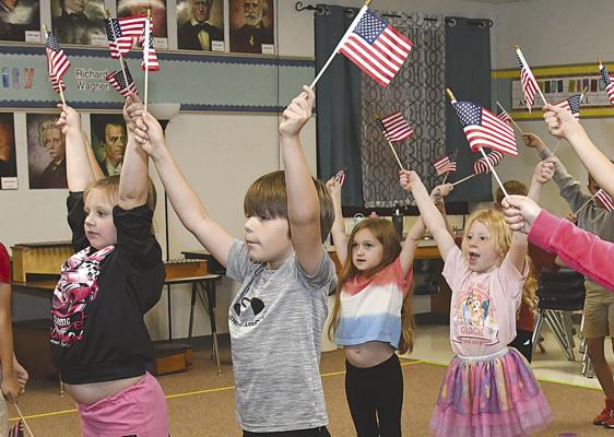 Second graders at Nancy Smith Elementary practice the song that they will present along with third and fourth grade classes during next Monday’s traditional Veterans Day program. Visitors should park in the circle drive, but golf carts will be provided to take them to the cafeteria. Donnie Lucas / Alb any News