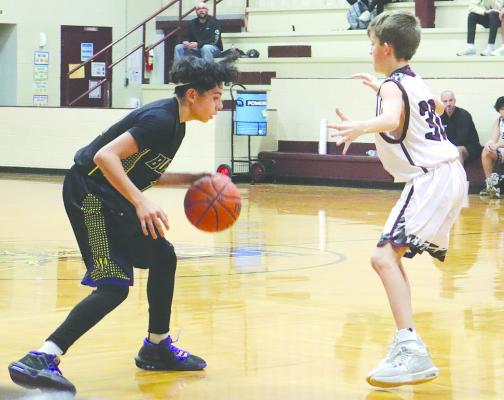 Christian Rodriguez (right) drives against a Eula defender during Monday night’s junior high game in Eula. Photo Provided By Moran School