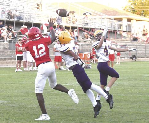 A Merkel defender tries to bat the ball away, but Jakobi Roberson (l) ends up with the reception from quarterback Aiden Vickers. The JV Lions will be in action again tonight as they take on the Bulldogs in Anson. Donnie Lucas / Albany News