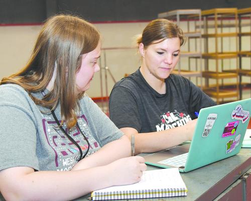 Albany’s new band director Jessica Watkins (r) works on the rehearsal schedule for summer band with assistant director Riley Lusk (l) during a recent workday in the AHS band hall. The two have been preparing for the 2024-2025 year, with practices beginning next Monday, July 22 for the percussion and front ensemble. Full rehearsals get underway July 29. Donnie Lucas / Albany News