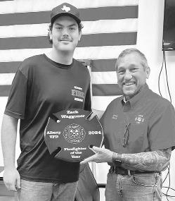 Fire Chief Joel Viertel presents the ‘Firefighter of the Year’ plaque to Zack Waggoner during the Albany Volunteer Fire Department’s annual awards presentation. COURTESY PHOTO