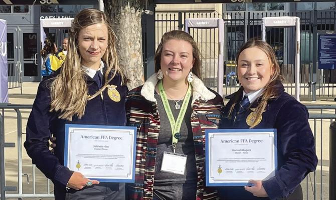 Moran graduates Johnnie Hise (l) and Hannah Rogers (r) post with MISD ag sponsor Minnie Denson Bennett after receiving their American FFA Degrees at the FFA National Convention. Photo Provided By Moran School