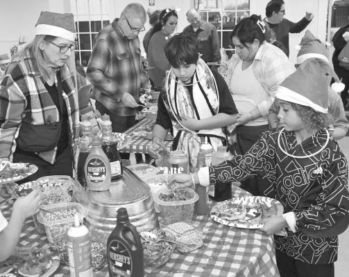 The topping station for pancakes will be available after the family hayride Sunday night at First Baptist Church. The event will include caroling, shut-in basket delivery, family pictures, and games. DONNIE LUCAS / ALBANY NEWS