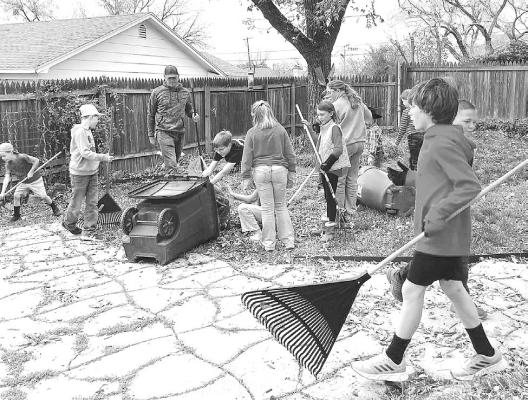 Almost two dozen members of the Shackelford County 4-H got together right before Christmas to rake leaves in the yards of several loyal volunteers at Closet Angels. The club regularly performs community service projects. Courtesy Photo
