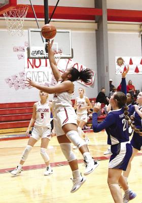 Albany senior Kiana Roberson flies in for a twopoint layup during the Lady Lions’ 50-35 win over Abilene Christian on Tuesday night. The girls have evened up their record at 2-2 going into a tournament this week in Munday. Albany will face Eula in the first round on Thursday. Donn ie Lucas / Albany News