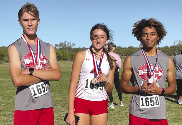 Jonathan Coody (l) and Ashlyn Miller (c), who are advancing to the regional tournament at the varsity level, as well as JV runner Jerrod Moses (r), all earned medals at the district cross country meet. Courtesy Photo
