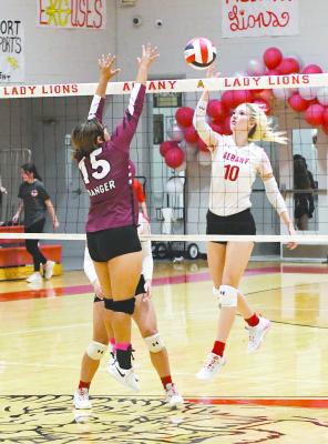 Caroline Holson watches the Ranger blocker and tips the ball back over the net during Albany’s three-set win over the Lady Bulldogs on Tuesday night. Albany will enter the playoffs as the second place team out of District 6-2A, with bi-district set for Oct. 31 against Water Valley. Donnie Lucas / Albany News