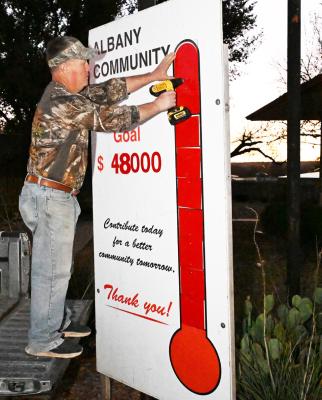Chris Beard places the final portion of the Community Chest as contributions push the goal past the 90% mark. DONNIE LUCAS / ALBANY NEWS