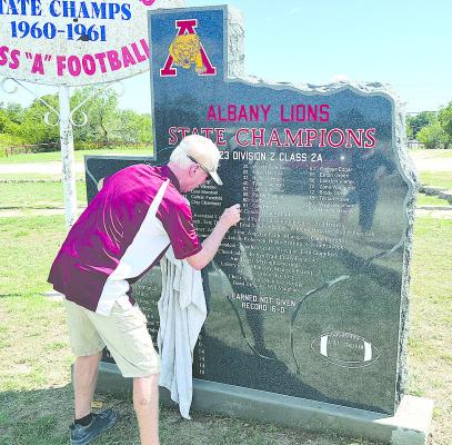 Davy Vestal polishes and puts some final touches on the 2023 state champion monument that was installed last week. School officials hope to schedule a dedication later in the year.