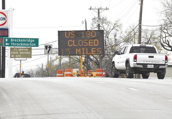 A sign near Allsup’s in Albany warns travelers that Hwy. 180 is closed 15 miles down the road due to the emergency closure of the “mile-long bridge” over Lake Hubbard. The structure was deemed unsafe and closed without warning on Dec. 22, but temporary repairs may allow it to reopen soon. Donnie Lucas / Alba ny News