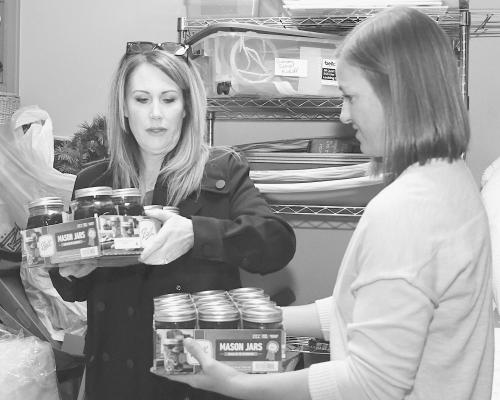 Kalico Leech (l) and Claire Ware (r) get home-canned jams and jellies ready to go as they and other MMPC members make preparations for this year’s annual Christmas Bazaar.. Complete with baked goods and a traditional Thanksgiving meal, the event is set for Nov. 9. Donnie Lucas / Albany News