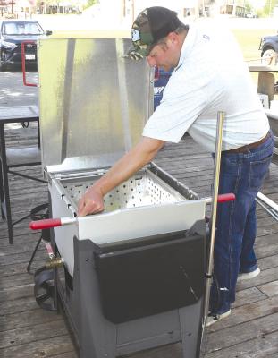 Board member Ramby Anderson gets his fryer cleaned up and ready to go for tonight’s annual Chamber Boil and Fish Fry set to start at 6:00 p.m. in the Depot parking lot. Only Chamber members are invited, but it’s never too late to join, and everyone can enjoy crawfish, shrimp, fried frish, onion rings, and more, all accompanied by some Cajun music. Donnie Lucas / Albany News