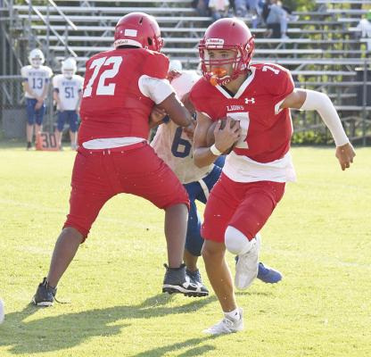 With J.J. Bolanos (l) providing a key block, Lyle Wheeler finds quite a bit of running room during the Cubs’ 46-14 win over Winters last Thursday. The seventh and eighth grade combined forces because Winters had only one team. Donnie Lucas / Albany News