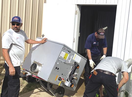 Workers with Cary Services bring in a new boiler to be installed as part of the Shackelford County Courthouse’s hydronic water heating and cooling system, replacing 25-year-old equipment that was installed during the Courthouse renovation in 2000. The chiller is also scheduled to be replaced later in the spring. Courtesy Photo