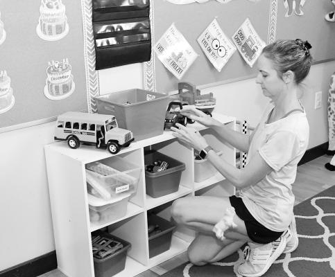 Mothers Day Out coordinator Meg Walser organizes toys as she and other teachers get ready for the start of the pre-school semester back in September. The program, conducted at Matthews Memorial Presbyterian Church, is one of 25 beneficiaries of Chest funds.