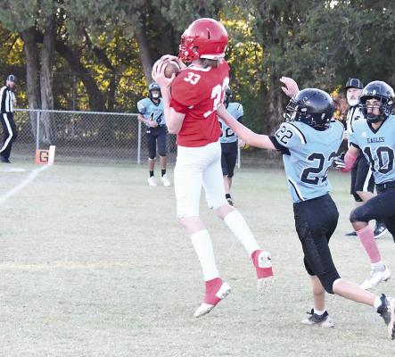 Sam Vickers secures the two-point conversion pass from Aaden Mendez to put the Albany JV in the lead 28-0 with seconds on the clock in the first quarter. The final score was 51-0. Donn ie Lucas / Albany News