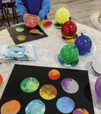 Participants in the Old Jail’s upcoming OJAC Galaxy will make “planets” using balloons and paint. The registration deadline for five different workshops is this Sunday, July 21.