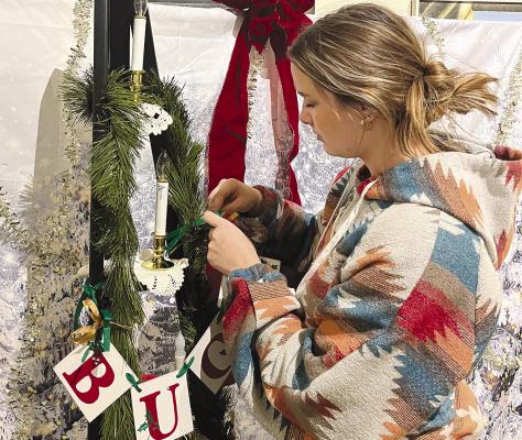 OJAC high school intern Emily Schedule begins to decorate a Ceppo for the upcoming Natale Celebration. Festival-goers are encouraged to bring a canned good to be placed on the Ceppo and later delivered to local food bank. DAVID WALLER / ALBANY NEWS