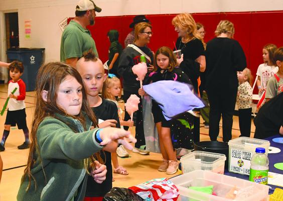 Even though wet weather forced this year’s Fall Fest indoors to the elementary gym, most participants didn’t let that bother them, as they made the rounds of booths. The Albany PTO, which sponsors the Fall Fest, is one of 24 organizations applying for Albany Chest funding Donn ie Lucas / Albany News