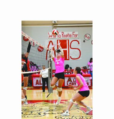 Senior Abi Hale appears to be setting the ball, but ends up tipping it over to catch the Colorado City defender unaware and gain Albany the point. The Lady Lions defeated the Lady Wolves in three sets on Tuesday night in the local gym. Albany will travel to TLCA in Abilene Oct. 12. Donnie Lucas / Albany News