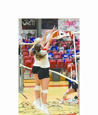 Madi Parrott (r) and Caroline Holson (l) successfully block a Veribest hit during Saturday’s matches. The Lady Lions open district play this week. Donnie Lucas / Albany News