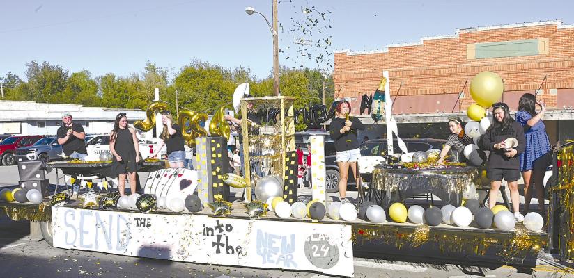 New Year’s Eve. Albany High School seniors celebrate the new year a few months early with their entry in last week’s homecoming parade. Floats depicting different holidays were put together by the high school and junior high classes, with the seniors getting second place recognition. Donnie Lucas /AlbanyNews